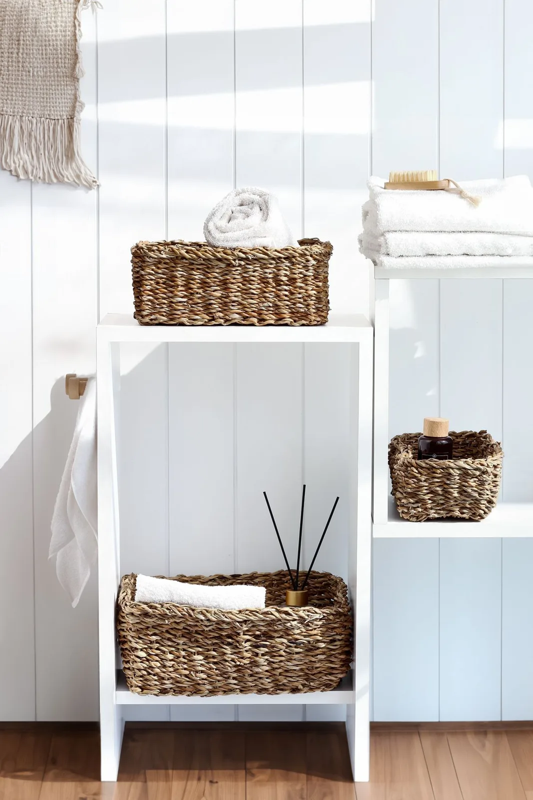 Stylish bathroom storage with wicker baskets on shelves, adding a natural touch to home decor.